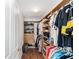 Walk-in closet features built-in shelving and hanging racks for organized storage at 929 Eastmont Ct, The Villages, FL 32162