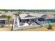 An aerial view of the backyard, featuring a patio and beautiful landscaping at 947 Couture St, The Villages, FL 32163