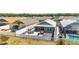 Aerial view of backyard showing patio, outdoor seating, and fenced yard at 947 Couture St, The Villages, FL 32163