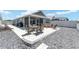 Enjoy the beautiful backyard with patio and outdoor seating at 947 Couture St, The Villages, FL 32163