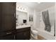 Bathroom features a sleek vanity, tub with shower, and ample storage at 947 Couture St, The Villages, FL 32163