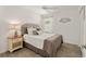 Well-lit bedroom with ceiling fan and stylish coastal decor at 947 Couture St, The Villages, FL 32163