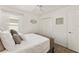 Comfortable bedroom featuring wood-look floors and a double door closet at 947 Couture St, The Villages, FL 32163