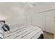 Bright bedroom with coastal-themed decor, wood-look floors, and closet at 947 Couture St, The Villages, FL 32163