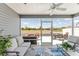 Inviting screened lanai, perfect for outdoor relaxation and entertaining at 947 Couture St, The Villages, FL 32163