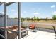 Enjoy beautiful views from this cozy outdoor patio and seating area at 947 Couture St, The Villages, FL 32163