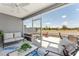 Enjoy the screened lanai with comfortable seating overlooking the backyard at 947 Couture St, The Villages, FL 32163