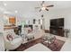 Open-concept living room provides space for entertaining with easy access to the kitchen and dining area at 9621 Se 168Th Maplesong Ln, The Villages, FL 32162
