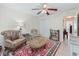 Cozy living room with tile flooring, comfortable seating, and lots of natural light at 9621 Se 168Th Maplesong Ln, The Villages, FL 32162
