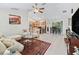 Open-concept floor plan showcasing a living room that flows into the kitchen and dining area at 9621 Se 168Th Maplesong Ln, The Villages, FL 32162