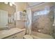 Bathroom featuring tiled shower, linen closet, and vanity with sink at 1606 Mount Croghan Trl, The Villages, FL 32162