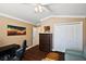 Bedroom featuring hardwood floors, natural light, and ample closet space at 10282 Julia Isles Ave, Oxford, FL 34484