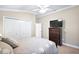Bedroom featuring ceiling fan, closet space and furnishings at 10282 Julia Isles Ave, Oxford, FL 34484