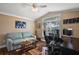Bedroom featuring hardwood floors, natural light, and desk space at 10282 Julia Isles Ave, Oxford, FL 34484