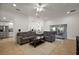 Spacious living room providing seamless access to both the kitchen and outdoor patio at 10282 Julia Isles Ave, Oxford, FL 34484