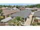 Aerial view of a well-maintained home with a gray shingle roof at 1084 Becker Ave, The Villages, FL 32163