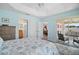 Cozy bedroom leading to a private outdoor patio and showcasing an ensuite bathroom and a walk-in closet at 1084 Becker Ave, The Villages, FL 32163