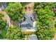 Aerial view of home surrounded by lush trees, showcasing property lines at 10851 Lantana Crst, Clermont, FL 34711