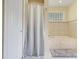 Bright bathroom with a soaking tub surrounded by decorative tile and a separate shower at 10851 Lantana Crst, Clermont, FL 34711