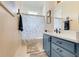Bathroom with single sink vanity and blue cabinet at 10851 Lantana Crst, Clermont, FL 34711