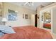 View of the bedroom featuring a cozy fuzzy orange blanket at 10851 Lantana Crst, Clermont, FL 34711