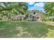 Charming single-Gathering home with stone accents, mature landscaping, and a well-manicured lawn at 10851 Lantana Crst, Clermont, FL 34711