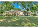 Charming single-story home with a large front lawn and stone facade accents at 10851 Lantana Crst, Clermont, FL 34711
