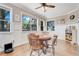 Well-lit game room offers a relaxed atmosphere with views and wooden furniture at 10851 Lantana Crst, Clermont, FL 34711