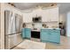 Well-equipped kitchen features modern stainless steel appliances and two-tone cabinetry at 10851 Lantana Crst, Clermont, FL 34711