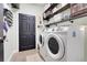 Laundry room with shelving and side-by-side washer and dryer at 10851 Lantana Crst, Clermont, FL 34711