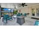 View of screened-in patio with furniture, dart board and grill at 10851 Lantana Crst, Clermont, FL 34711