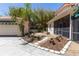 Charming backyard with lush landscaping, including palms and bamboo, creating a private oasis at 1196 Lakeshore Dr, Mount Dora, FL 32757
