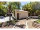 Backyard featuring a detached building, garden, and walkway in landscaped backyard at 1196 Lakeshore Dr, Mount Dora, FL 32757