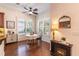 Bright breakfast nook with wood floors, a table set for two, and windows with plantation shutters at 1196 Lakeshore Dr, Mount Dora, FL 32757