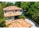 Overhead shot highlights the tile roof, covered patio, and lengthy driveway at 1196 Lakeshore Dr, Mount Dora, FL 32757