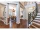 Grand entrance with hardwood floors and view of staircase, dining room at 1196 Lakeshore Dr, Mount Dora, FL 32757
