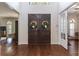 Inviting front entrance boasts double doors, hardwood floors, and high ceilings at 1196 Lakeshore Dr, Mount Dora, FL 32757