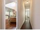 Hallway with hardwood floors leads to the living room and bedroom at 1196 Lakeshore Dr, Mount Dora, FL 32757