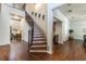 Spacious hallway features hardwood floors and access to various living spaces at 1196 Lakeshore Dr, Mount Dora, FL 32757