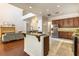 Open concept kitchen boasts stainless steel appliances, hardwood floors and view of the living room at 1196 Lakeshore Dr, Mount Dora, FL 32757