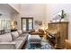 Spacious living room with high ceilings, piano, and plush seating at 1196 Lakeshore Dr, Mount Dora, FL 32757