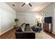 Cozy living room with hardwood flooring, stylish decor, and ample natural light at 1196 Lakeshore Dr, Mount Dora, FL 32757