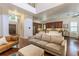 Open-concept living room with wood floors, a plush sofa, open floorplan and bar seating at 1196 Lakeshore Dr, Mount Dora, FL 32757
