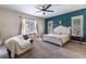 Serene main bedroom features a large bed, accent wall, and lots of natural light at 1196 Lakeshore Dr, Mount Dora, FL 32757
