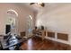Home office with hardwood floors, speaker system, two arched windows and wood trim at 1196 Lakeshore Dr, Mount Dora, FL 32757