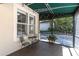 Outdoor screened in patio with seating that offers a relaxing outdoor experience at 1196 Lakeshore Dr, Mount Dora, FL 32757