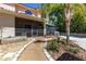 An outdoor screened in lanai and lush landscaping offer an inviting space to relax and entertain at 1196 Lakeshore Dr, Mount Dora, FL 32757