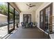 Relaxing screened porch featuring comfortable seating and views of the beautifully landscaped backyard at 1196 Lakeshore Dr, Mount Dora, FL 32757