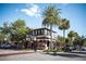 Charming street view with outdoor seating, shade trees, and quaint street view at 1196 Lakeshore Dr, Mount Dora, FL 32757