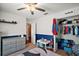 Adorable ' bedroom featuring playful decor, a comfortable bed, and ample storage at 12340 Ne 48Th Loop, Oxford, FL 34484